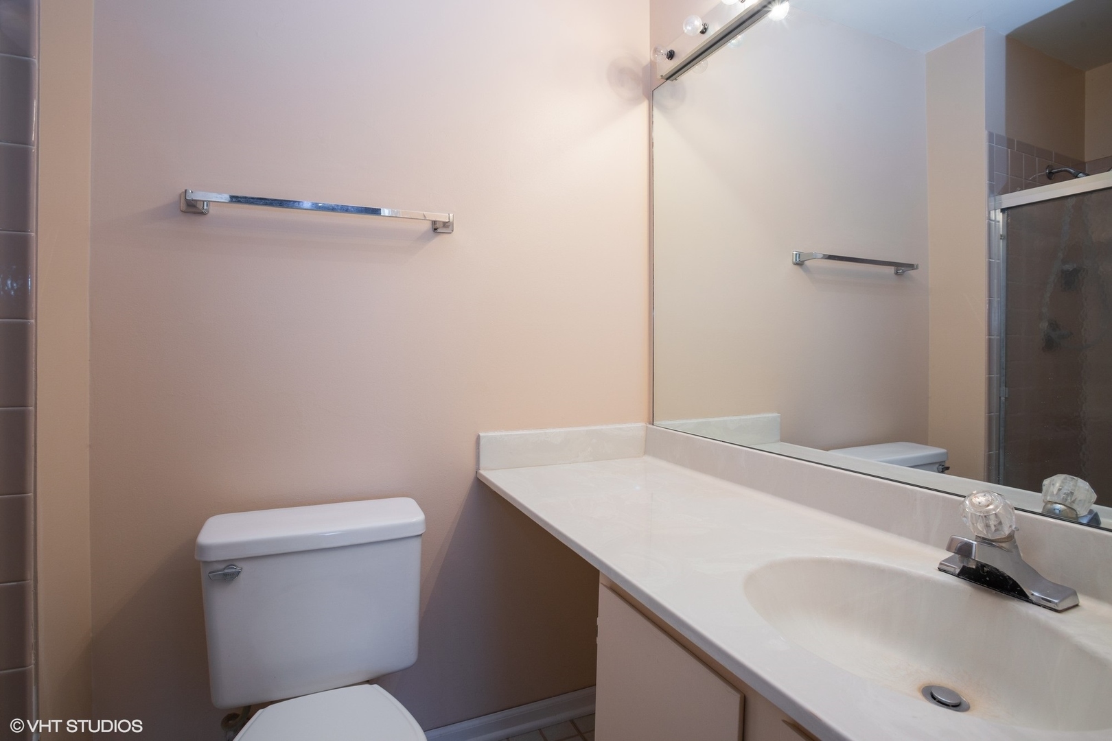 501 Cumberland Trail, Unit D Roselle, IL 60172 - Photo 7 of 10 a bathroom with a sink toilet and vanity