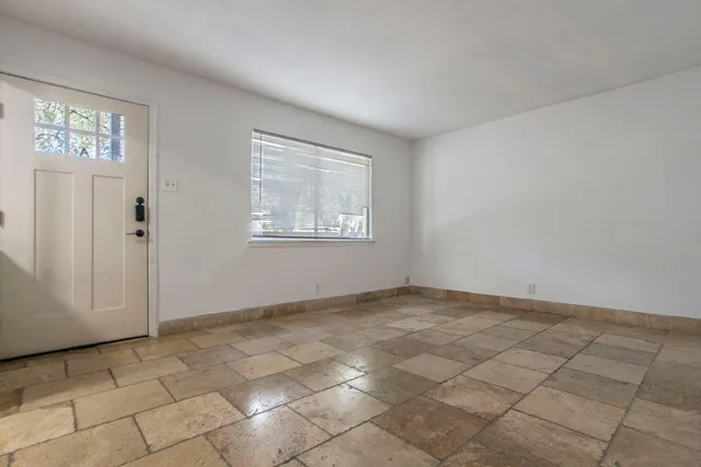 an empty room with windows