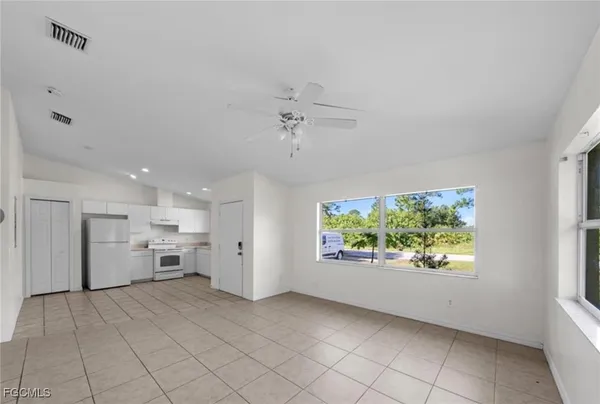 a view of a kitchen with furniture and a window