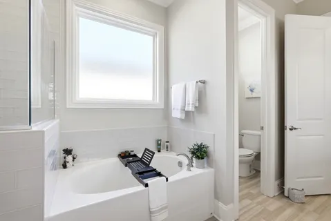 a bathroom with a bathtub and a sink