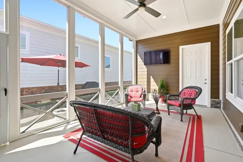a room with furniture and a large window