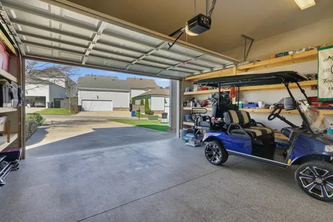 a view of parking garage with cars