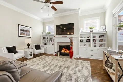 a view of a livingroom with furniture and a fireplace