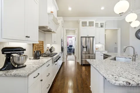 a kitchen with a sink stove and refrigerator