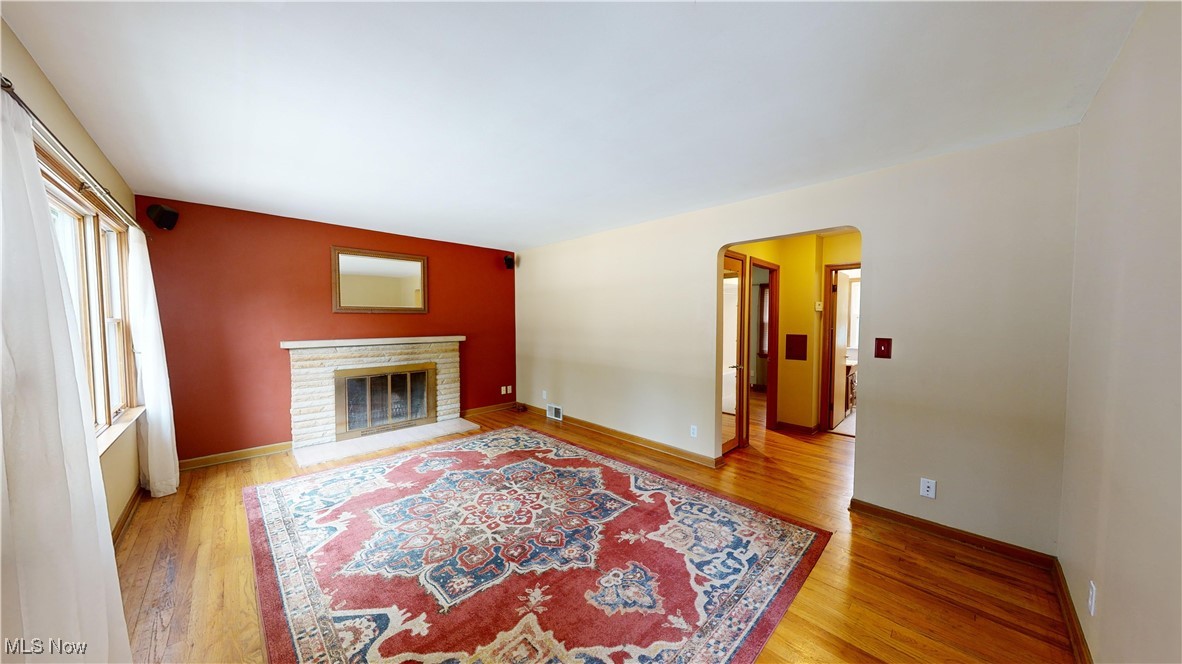 29280 White Road Wickliffe, OH 44092 - Photo 3 of 43 Living room featuring a fireplace and light wood-type flooring
