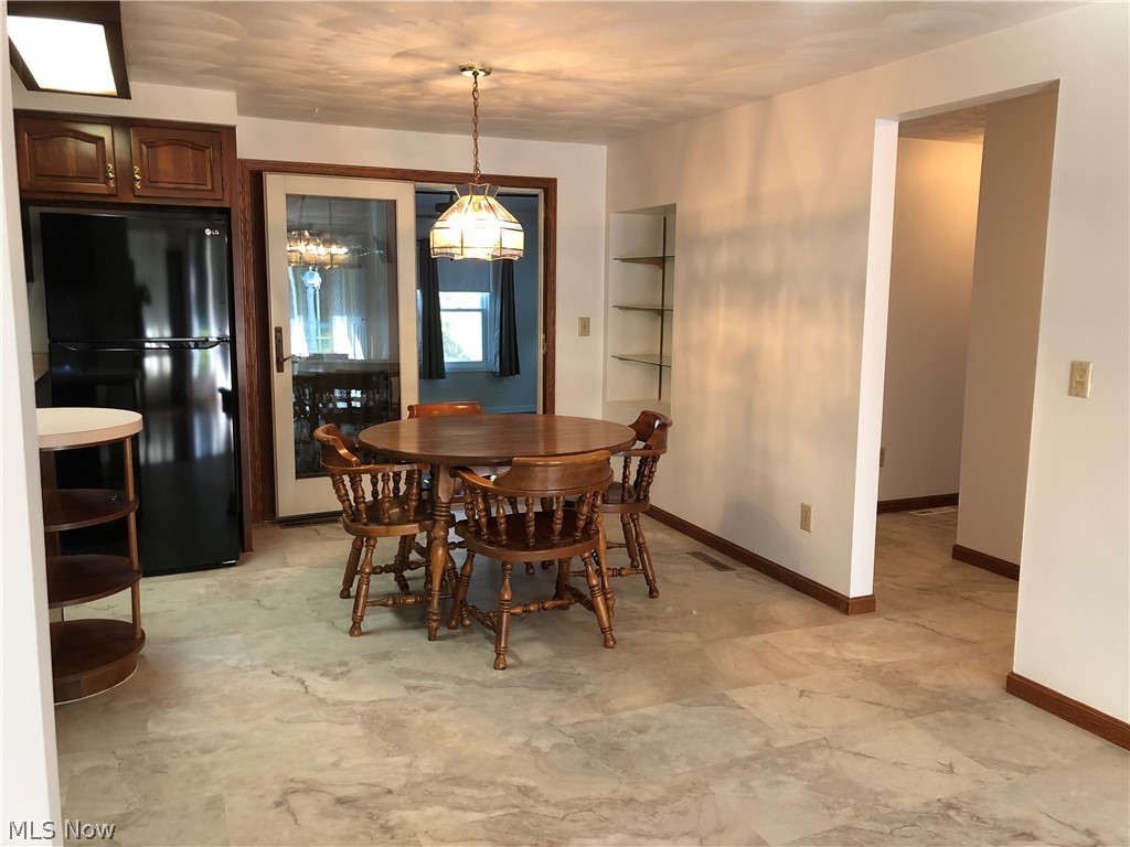 63333 Johnson North Road Bethesda, OH 43719 - Photo 9 of 35 Dining area- new flooring in kitchen and dining room