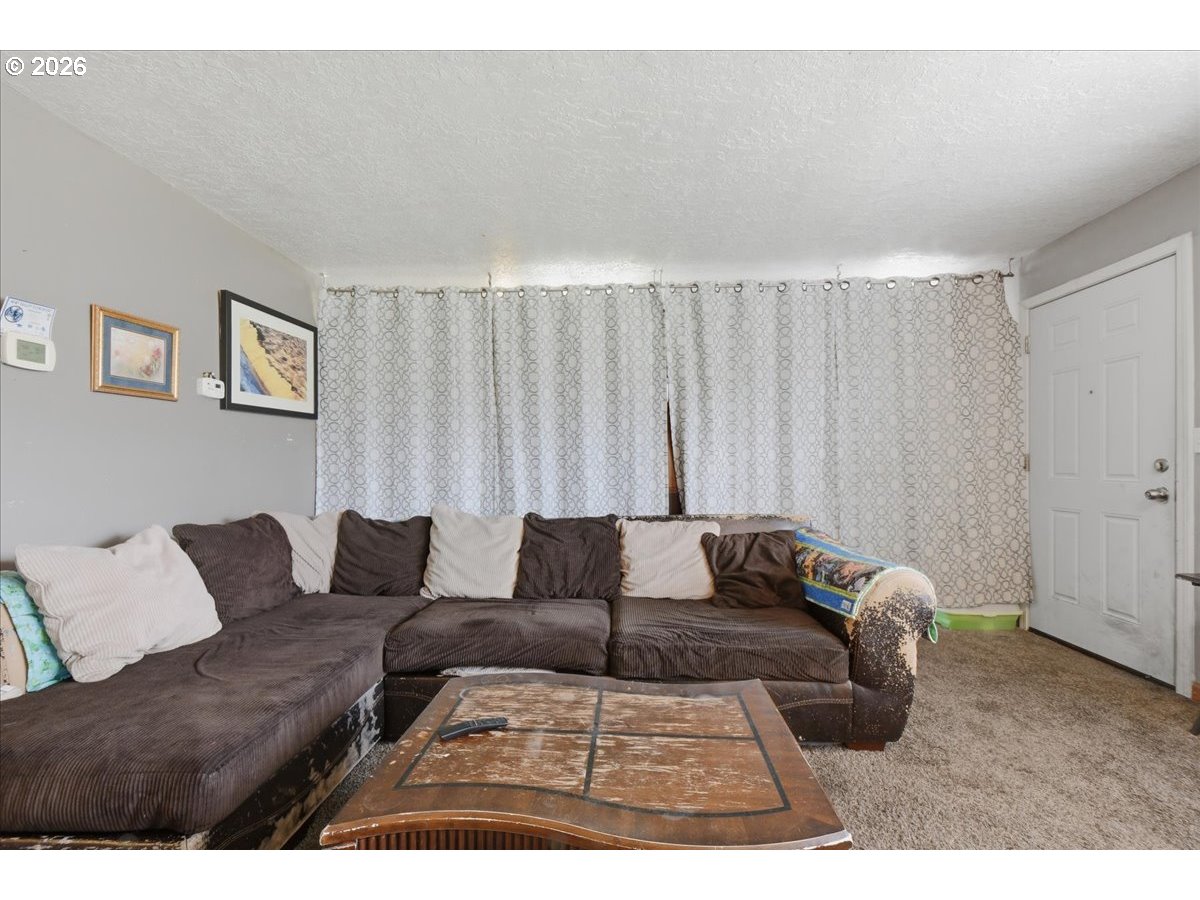 3287 Olive Way Longview, WA 98632 - Photo 6 of 24 a living room with furniture and a couch