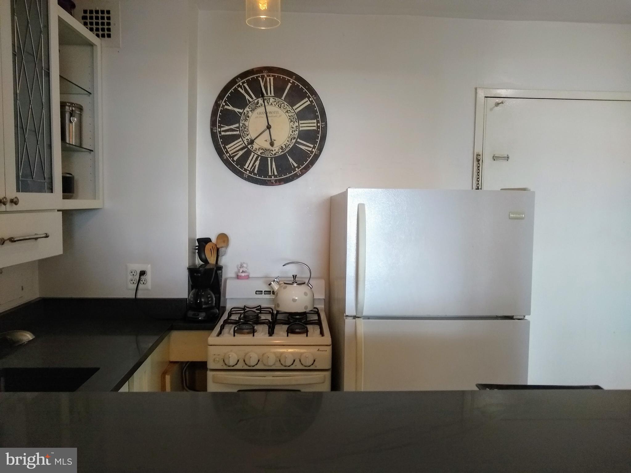 2800 Wisconsin Avenue Northwest, Unit 705 Washington, DC 20007 - Photo 18 of 42 View into kitchen from bar