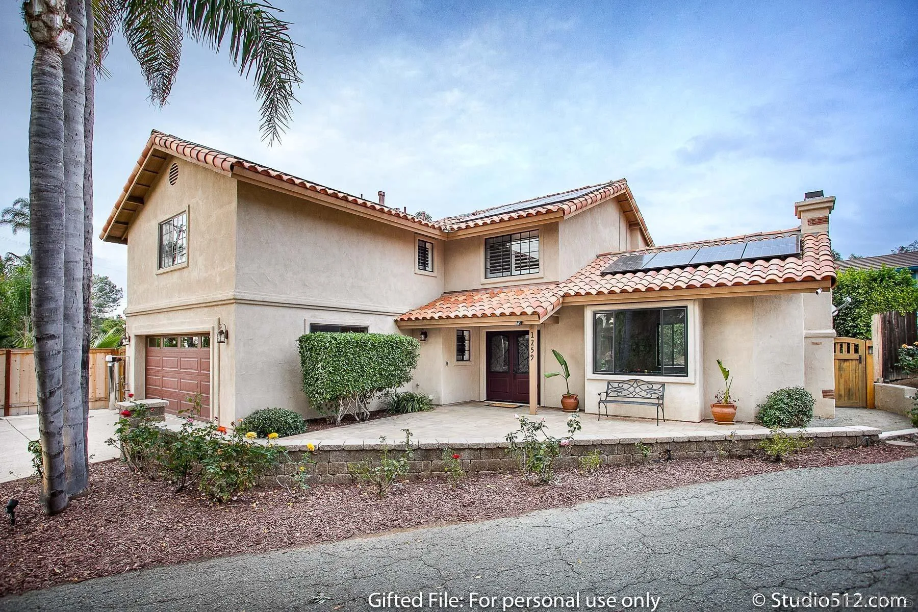 1259 Grandview Road Vista, CA 92084 - Photo 29 of 41 a front view of a house with a yard and garage
