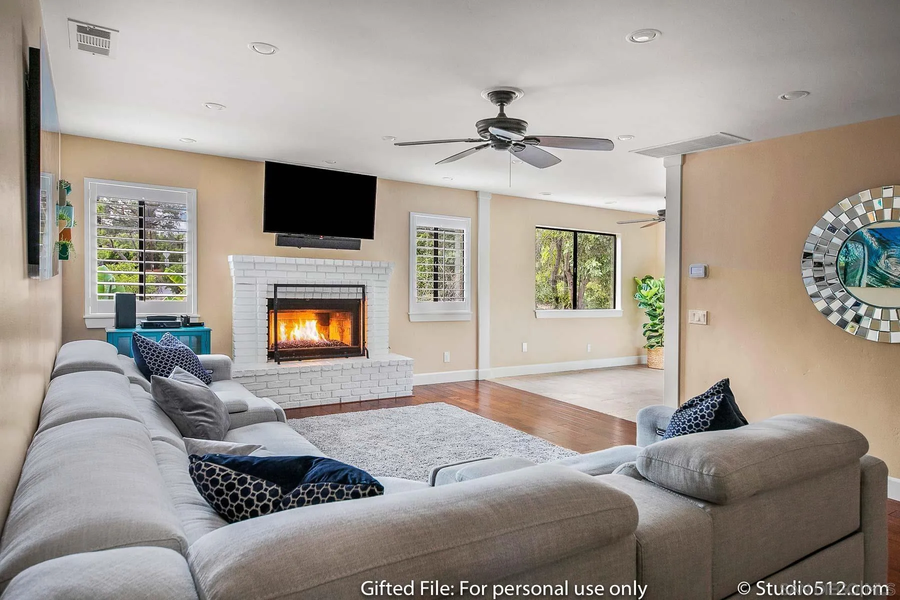 1259 Grandview Road Vista, CA 92084 - Photo 9 of 41 a living room with furniture a fireplace and a flat screen tv
