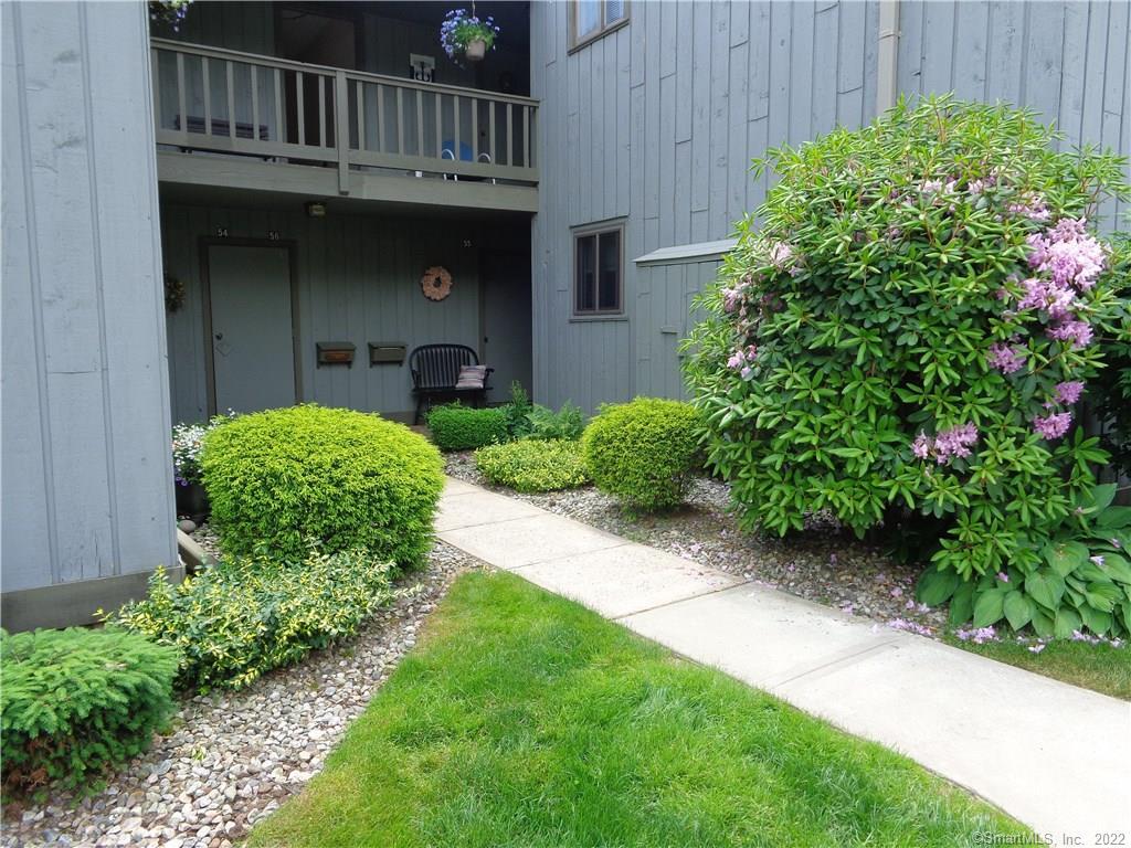 55 Village Road, Unit 55 Southington, CT 06489 - Photo 1 of 1 a front view of a house with garden