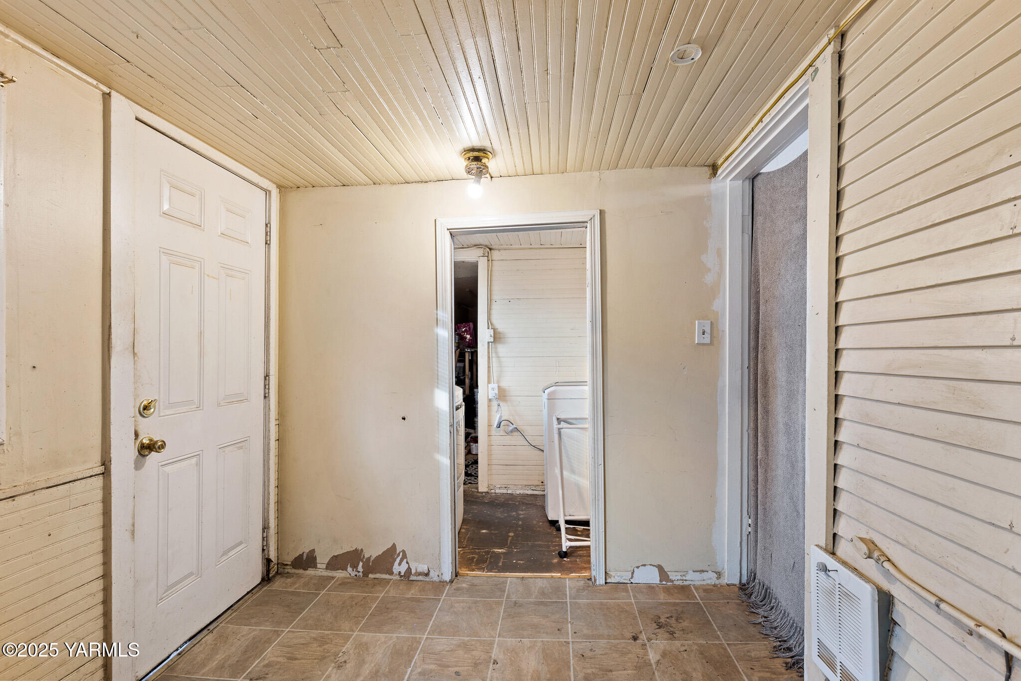 2832 South Wiley Road Yakima, WA 98903 - Photo 12 of 21 a view of a hallway with wooden shelves