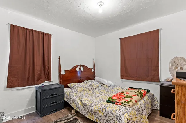 a bedroom with a bed and a closet