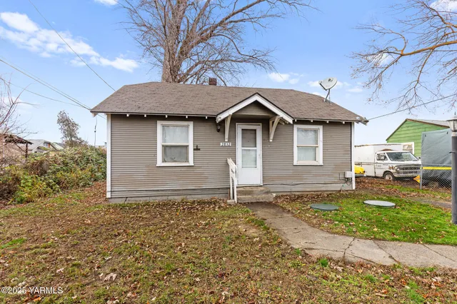 a house with trees in the background