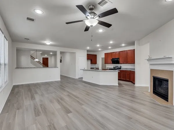 a view of a kitchen with a stove cabinets and wooden floor