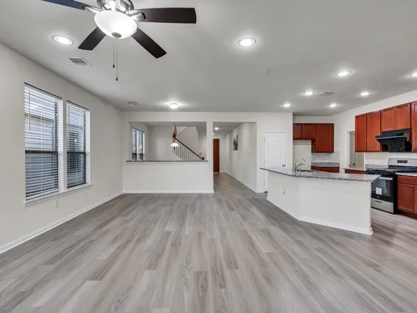 a view of kitchen with cabinets and wooden floor