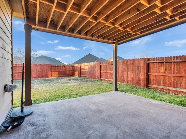 a view of an house with backyard and porch