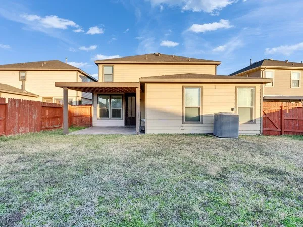 a view of a house with backyard and garden