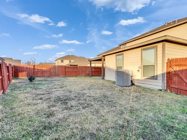 a view of a livingroom with furniture and staircase
