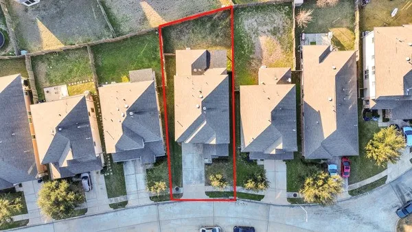 an aerial view of residential building and ocean