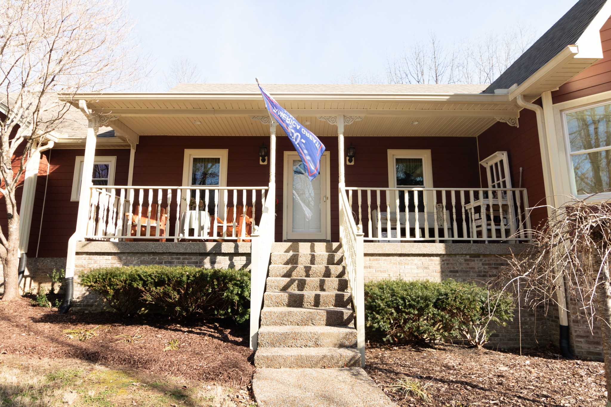 7780 Caney Fork Road Fairview, TN 37062 - Photo 8 of 49 a front view of a house with a garden