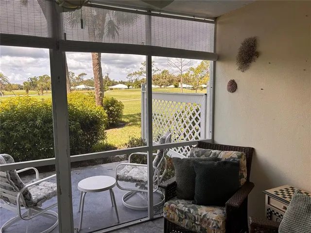 a view of a chair and table in the balcony