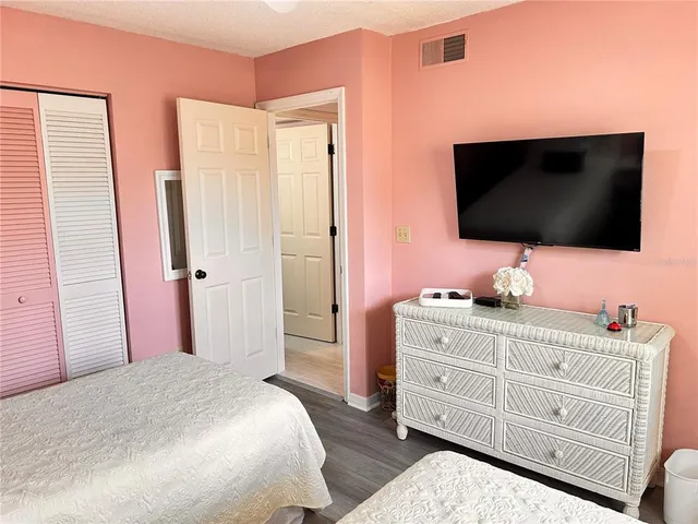 a bedroom with double bed and a window