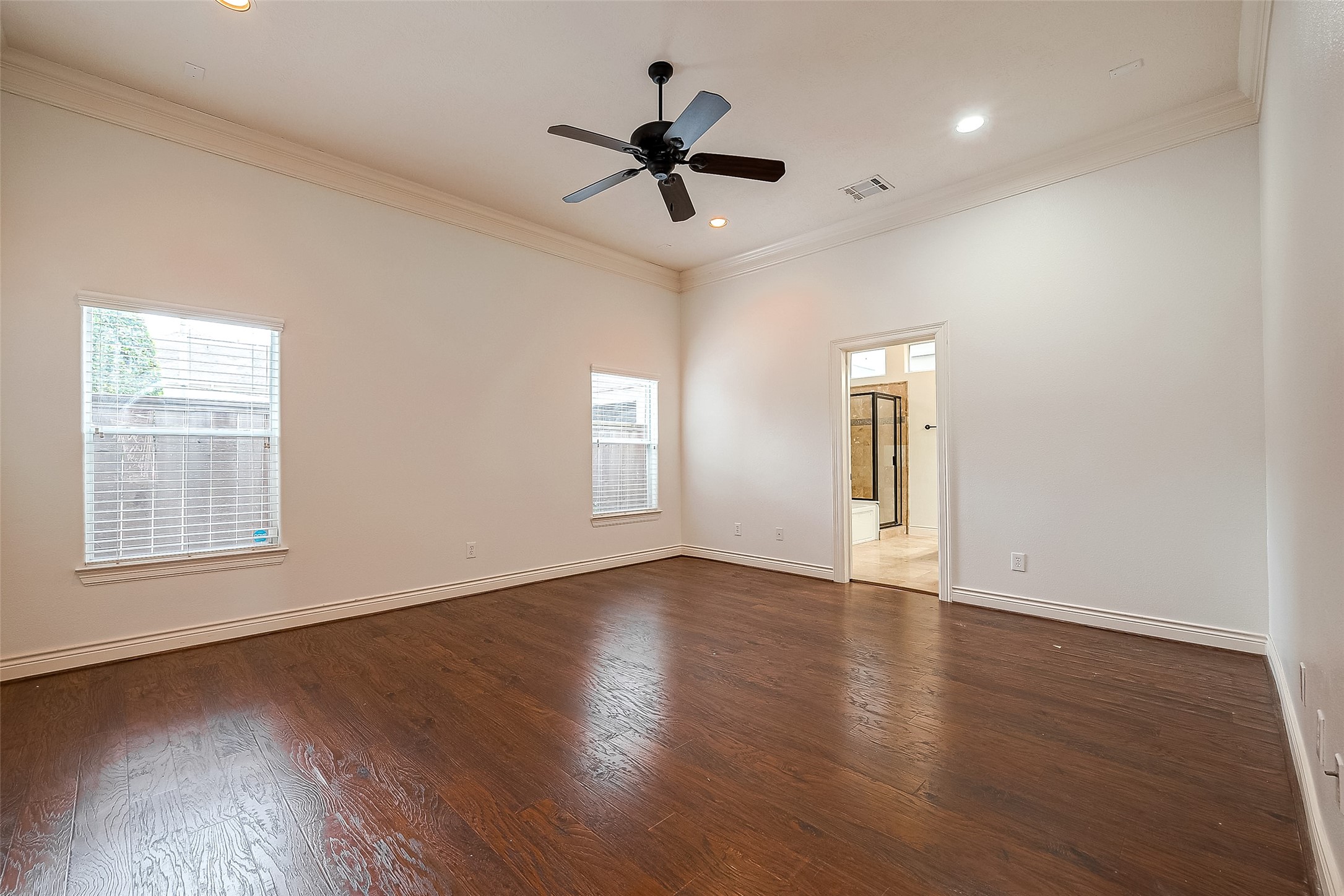 5608 Kansas Street, Unit B Houston, TX 77007 - Photo 14 of 24 View of primary bedroom, hardwood flooring and recessed lighting throuhout.
