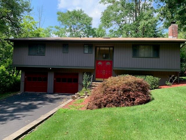 104 Grotke Road Chestnut Ridge, NY 10977 - Photo 1 of 1 a front view of a house with a garden