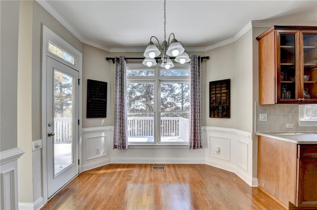 1601 Woodbow Crossing Dacula, GA 30019 - Photo 16 of 51 a view of a room with wooden floor and staircase