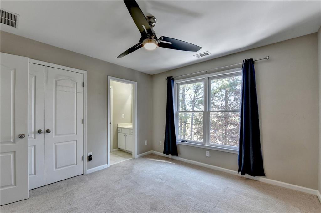 1601 Woodbow Crossing Dacula, GA 30019 - Photo 20 of 51 a view of empty room with windows