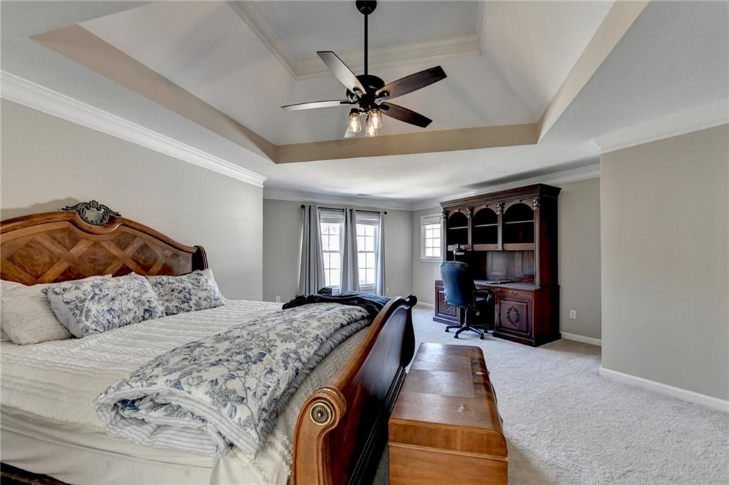 1601 Woodbow Crossing Dacula, GA 30019 - Photo 22 of 51 a bedroom with a bed and window