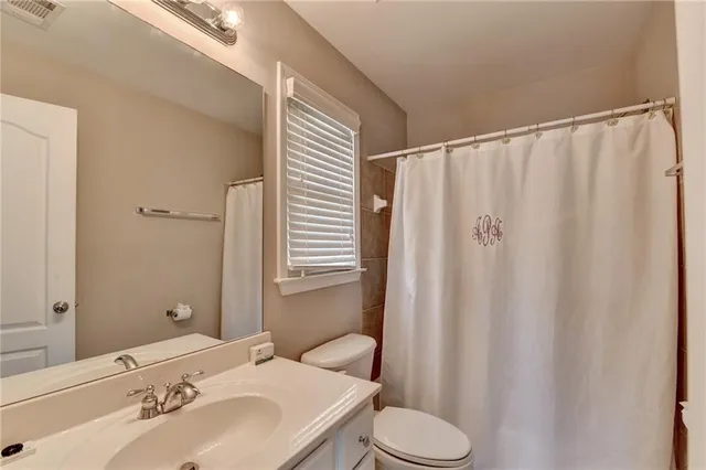 a bathroom with a sink and toilet