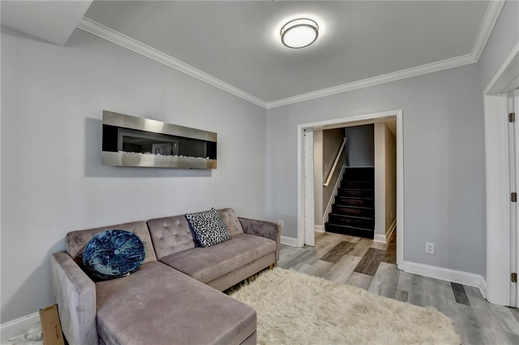 1601 Woodbow Crossing Dacula, GA 30019 - Photo 30 of 51 a living room with furniture and a flat screen tv