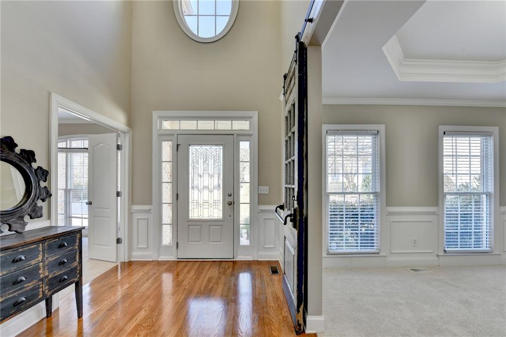 1601 Woodbow Crossing Dacula, GA 30019 - Photo 3 of 51 wooden floor in a en suite bathroom with a sink