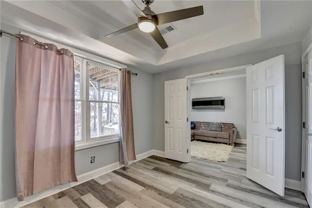 a bedroom with furniture and a window