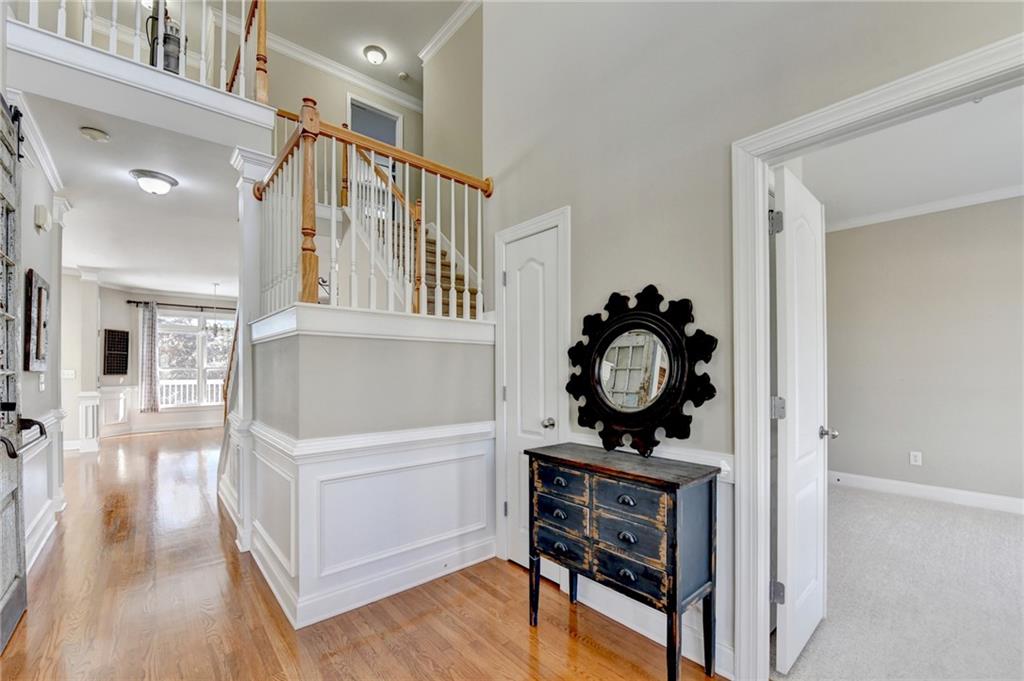 1601 Woodbow Crossing Dacula, GA 30019 - Photo 4 of 51 a view of a hallway view with wooden floor and staircase