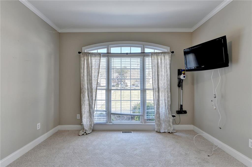 1601 Woodbow Crossing Dacula, GA 30019 - Photo 8 of 51 a view of an empty room with a window