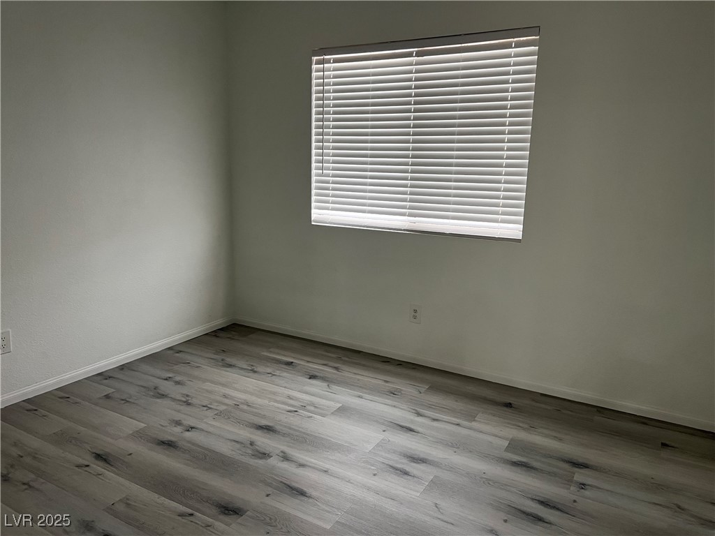Undisclosed Address Las Vegas, NV 89142 - Photo 12 of 23 Empty room with wood finished floors and baseboard