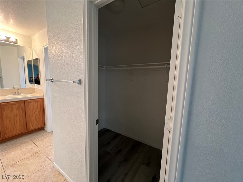 Undisclosed Address Las Vegas, NV 89142 - Photo 16 of 23 Bathroom with a textured wall, vanity, a spacious