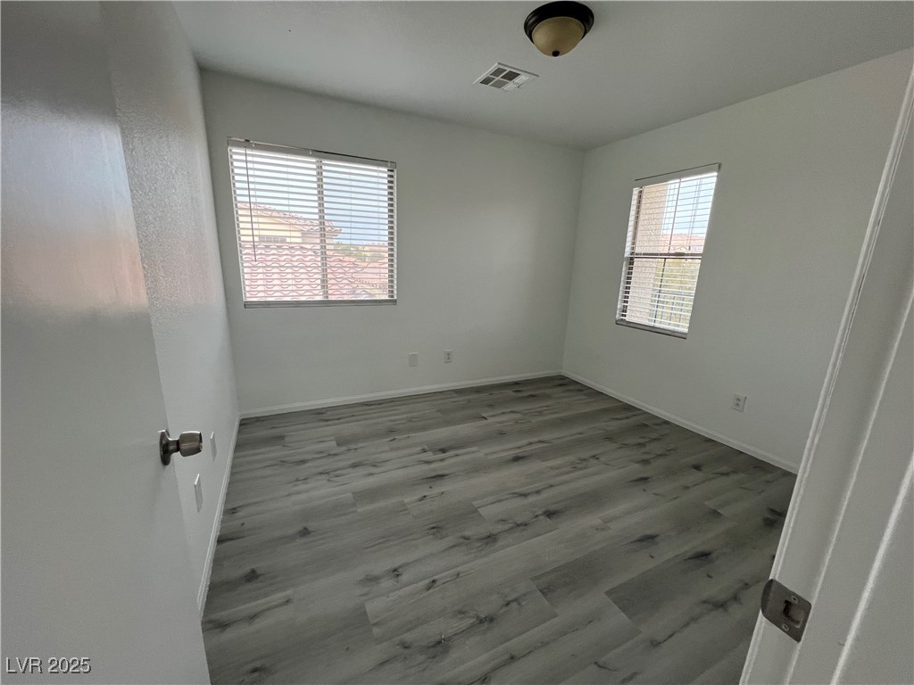 Undisclosed Address Las Vegas, NV 89142 - Photo 21 of 23 Spare room with plenty of natural light, baseboard