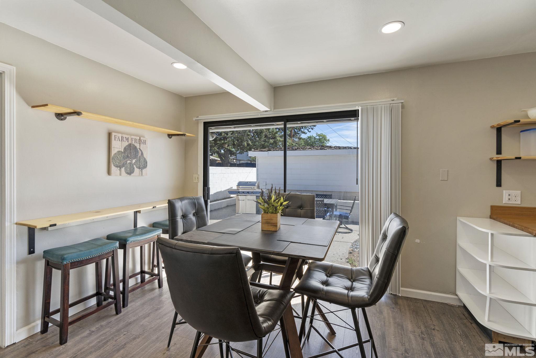 840 Bates Avenue Reno, NV 89502 - Photo 14 of 39 a view of a dining room with furniture window and wooden floor