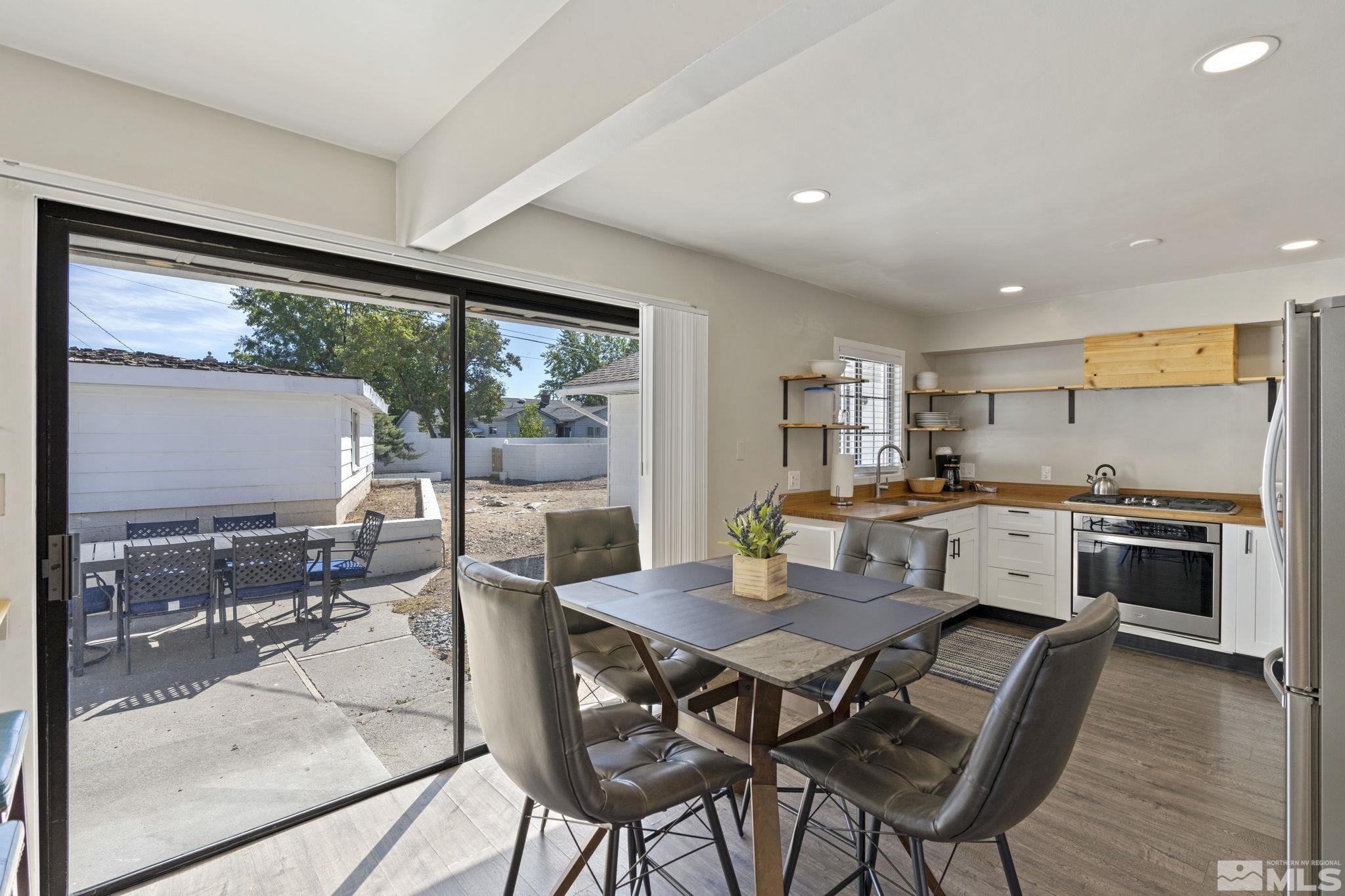 840 Bates Avenue Reno, NV 89502 - Photo 15 of 39 a view of a dining room with furniture window and outside view