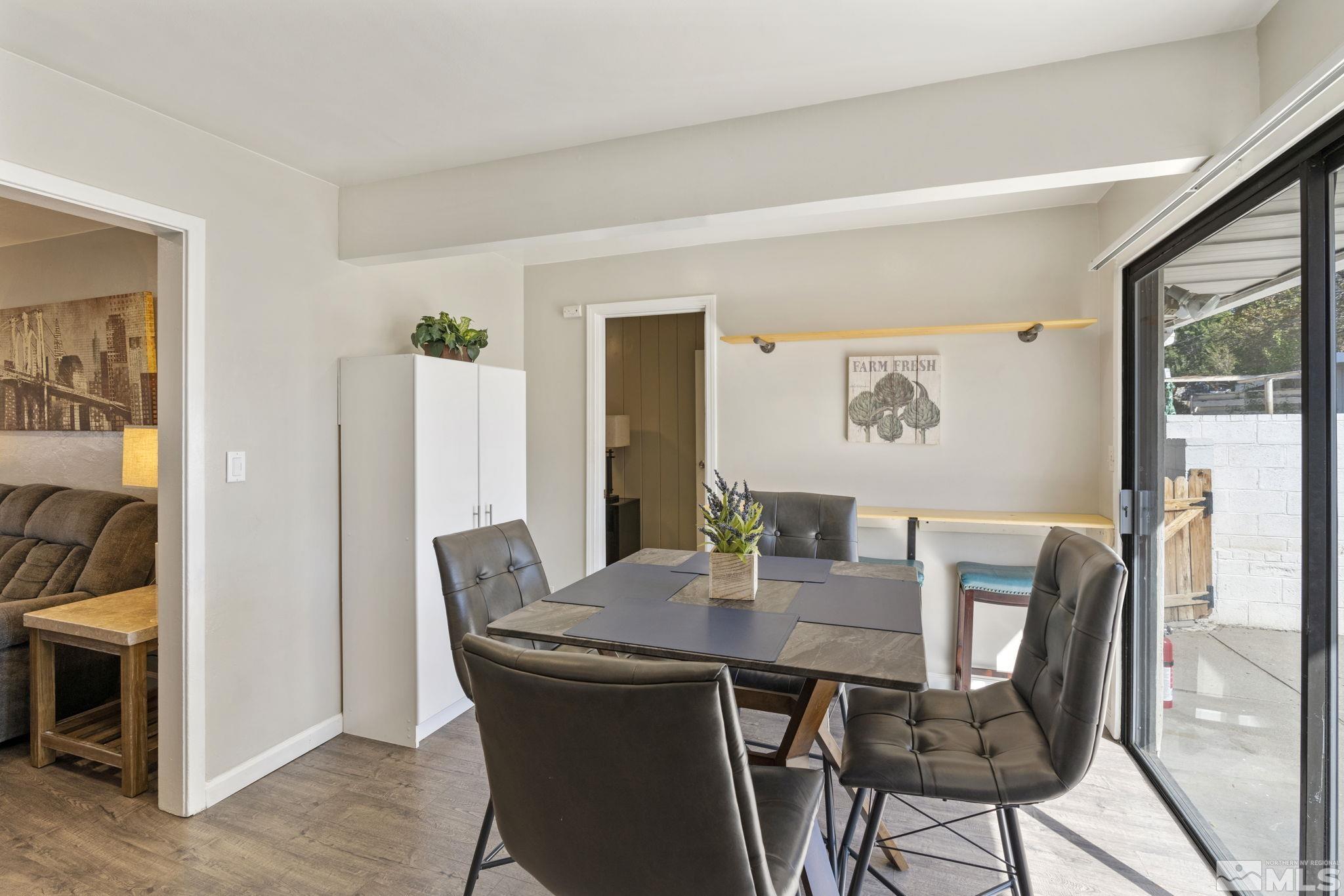 840 Bates Avenue Reno, NV 89502 - Photo 17 of 39 a view of a dining room with furniture and wooden floor