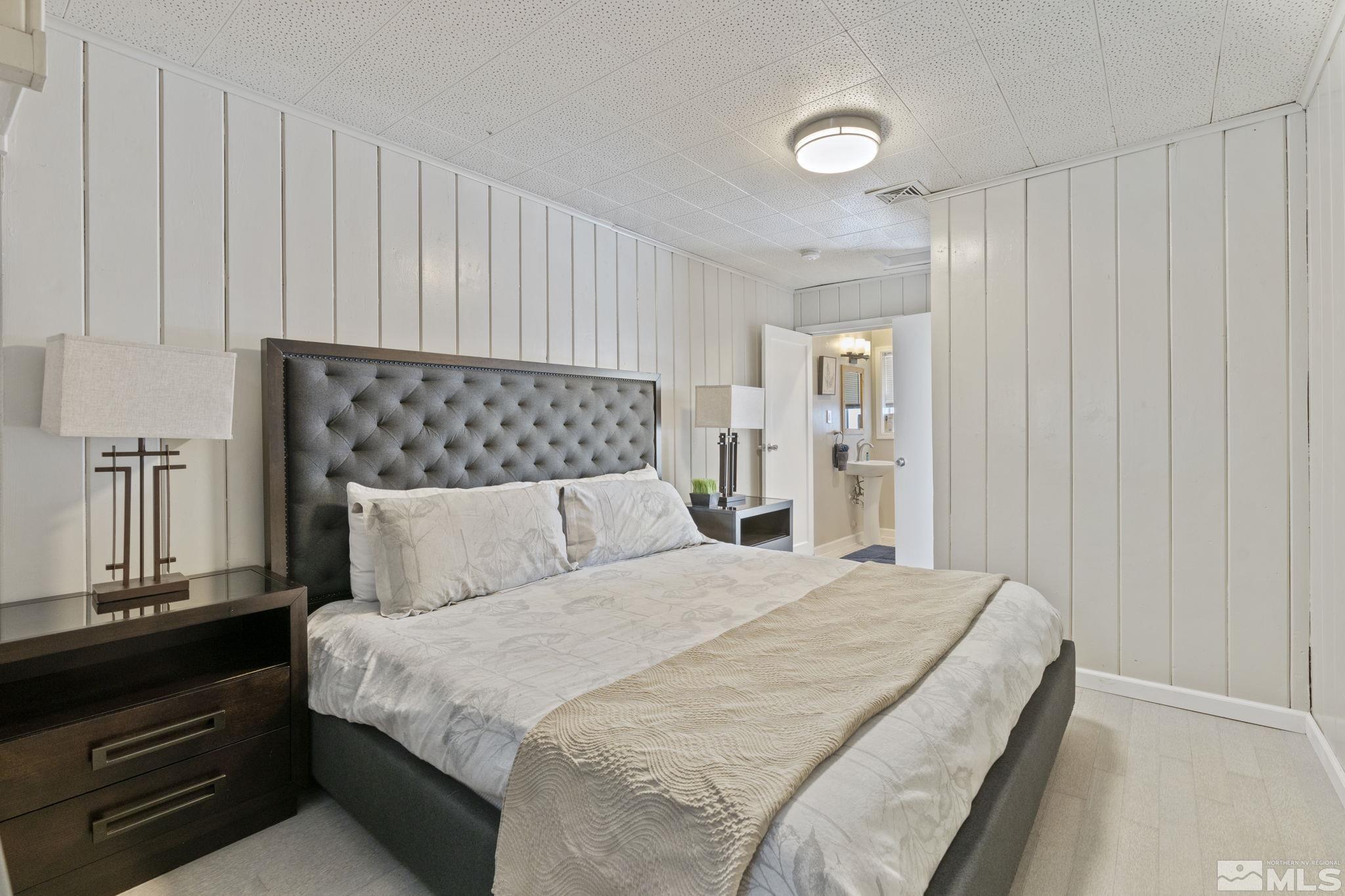 840 Bates Avenue Reno, NV 89502 - Photo 19 of 39 a bed room with a bed and a night stand