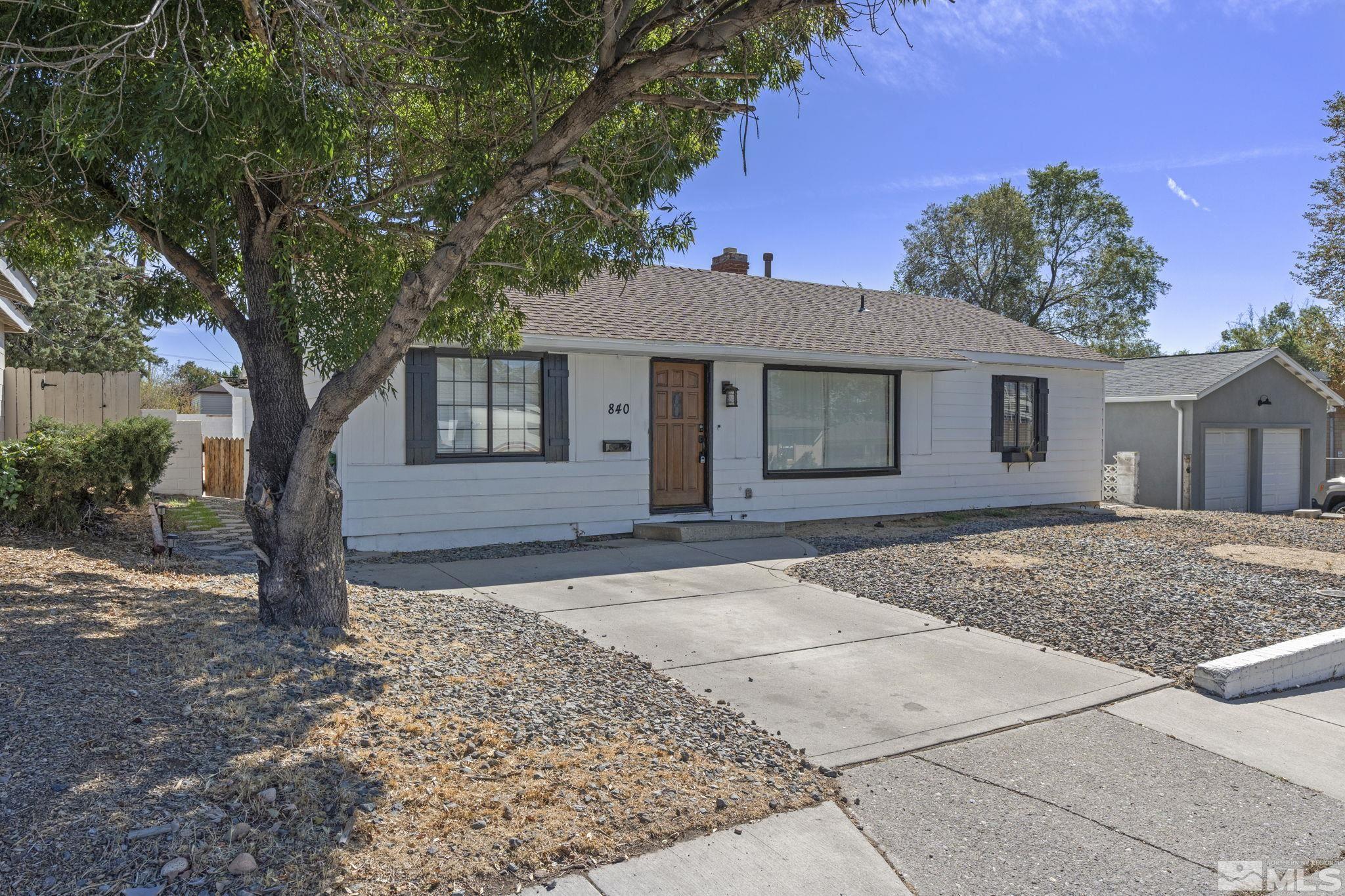 840 Bates Avenue Reno, NV 89502 - Photo 2 of 39 a front view of a house with a garden