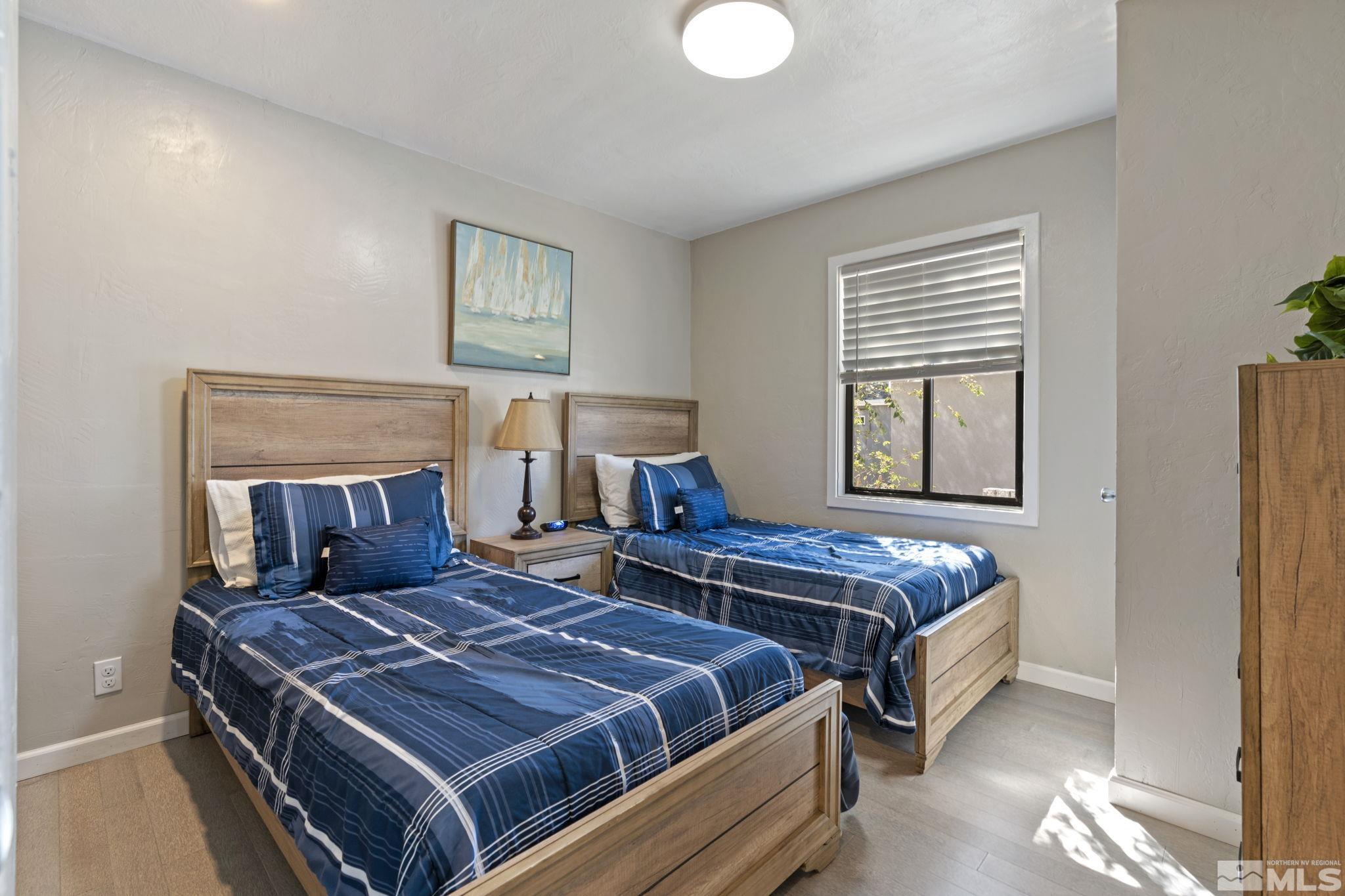 840 Bates Avenue Reno, NV 89502 - Photo 23 of 39 a bed sitting in a bedroom next to a window
