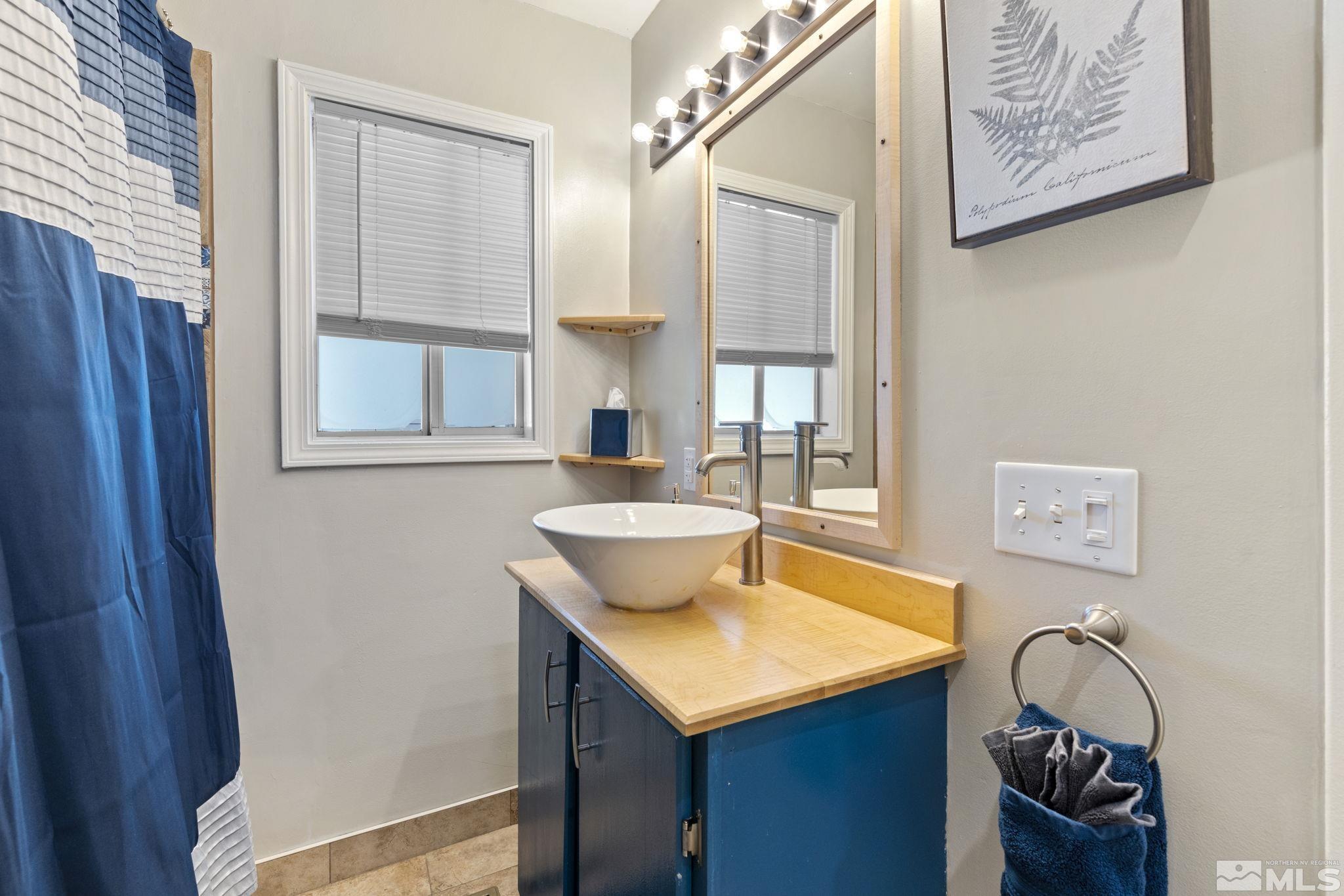 840 Bates Avenue Reno, NV 89502 - Photo 24 of 39 a bathroom with a sink and a mirror