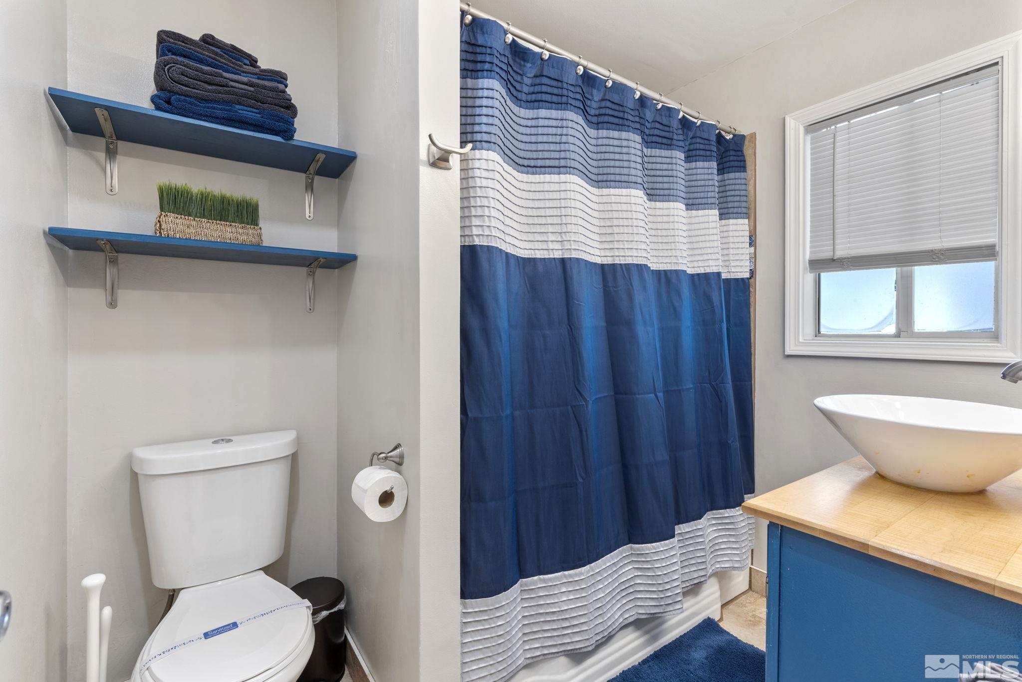 840 Bates Avenue Reno, NV 89502 - Photo 25 of 39 a bathroom with a toilet and a sink