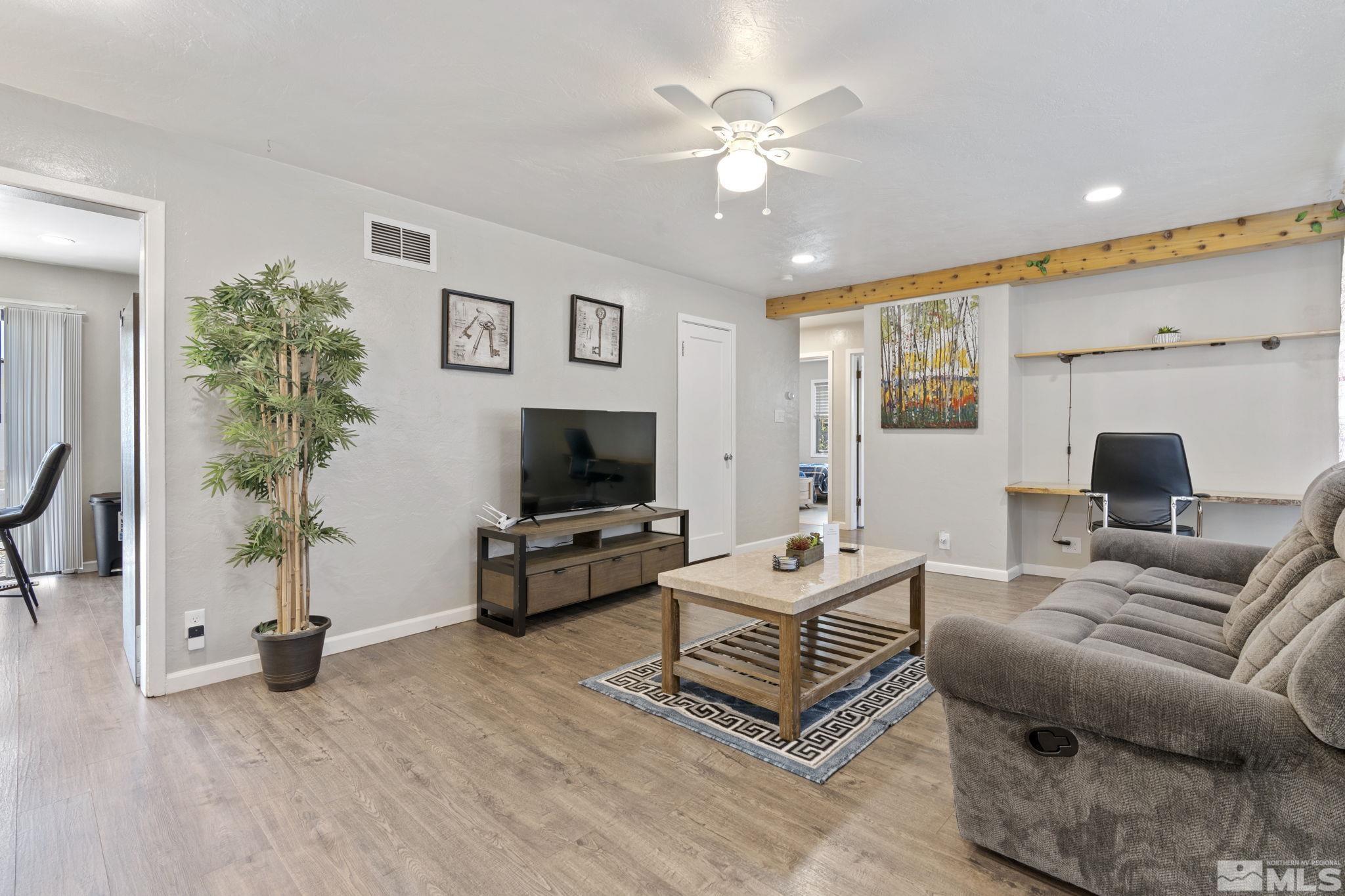 840 Bates Avenue Reno, NV 89502 - Photo 3 of 39 a living room with furniture and a flat screen tv